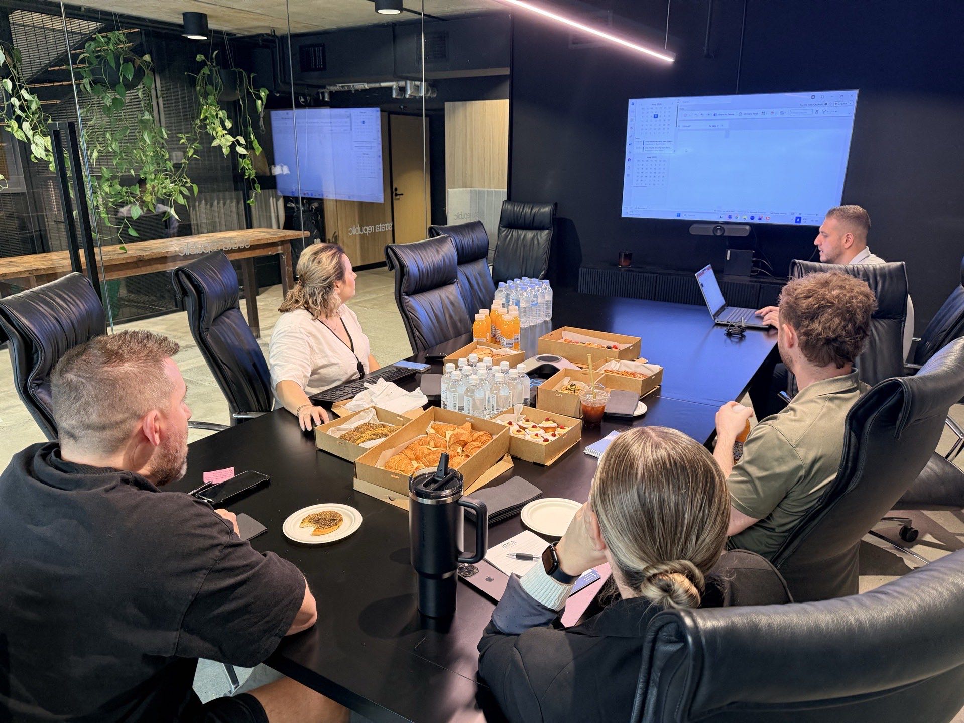 EBS Lunch & Learn session, team around a boardroom table